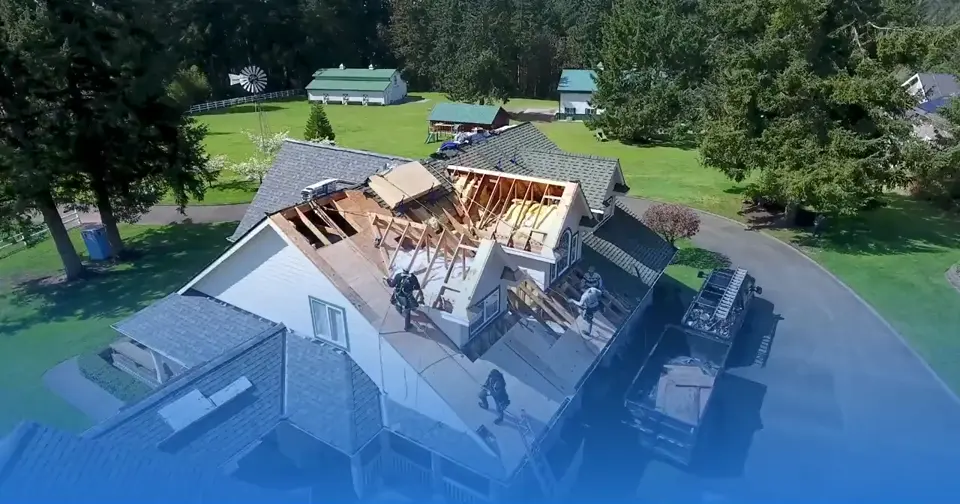 Aerial view of a Van Martin Roofing crew replacing a residential roof